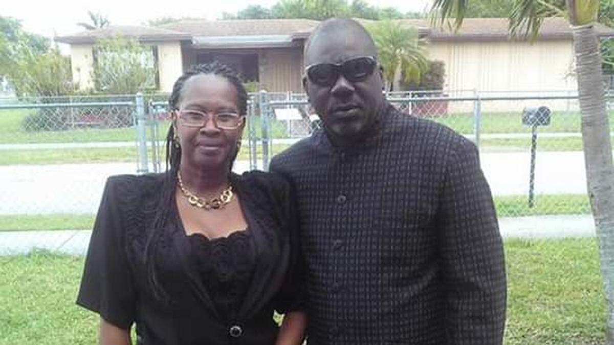 Dennis McGhee, shown recently with his wife, was shot and killed while mowing his lawn the day before Christmas. His nephew, Fla. State Rep. Kionne McGhee said he was killed by a stray bullet, though police have not confirmed that.