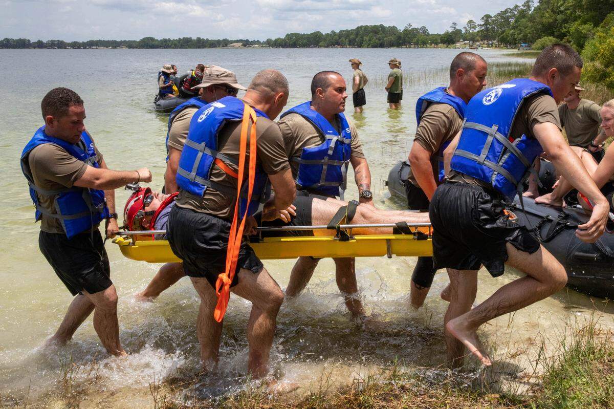 Florida State Guard recruits receive aquatic skills instruction from Florida National Guard soldiers and civilian contractors to execute a water survival training exercise at Camp Blanding, Florida, June 14, 2023. Soldiers with the 53rd Infantry Brigade Combat Team, 83rd Troop Command, and 50th Regional Support Group supplemented the multi-day training that included rescue swimming, entering and exiting water vehicles, water survival techniques and water vehicle maneuvering.
