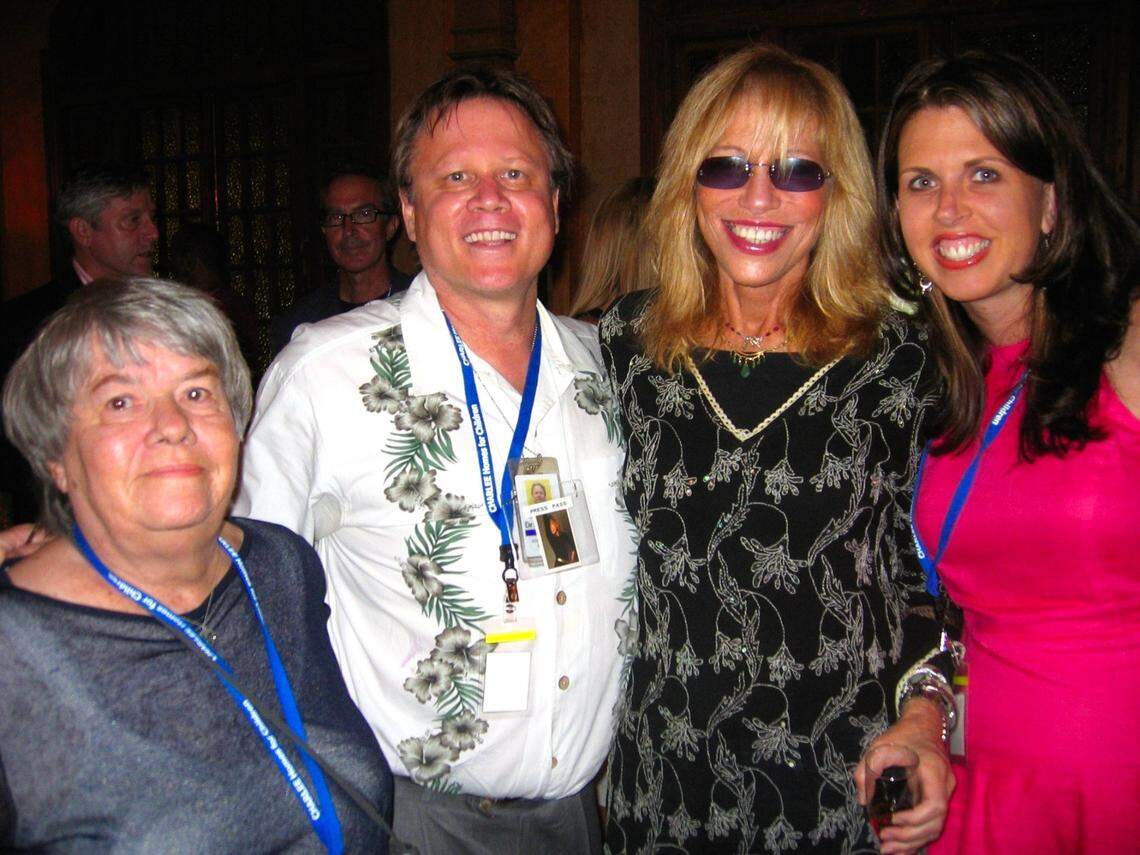 Claire Laurence, her son Howard Cohen from the Miami Herald, singer Carly Simon, and Jennifer Barr Lefelar catch up with Carly Simon after her concert at the Gusman Center in downtown Miami on May 16, 2008.
