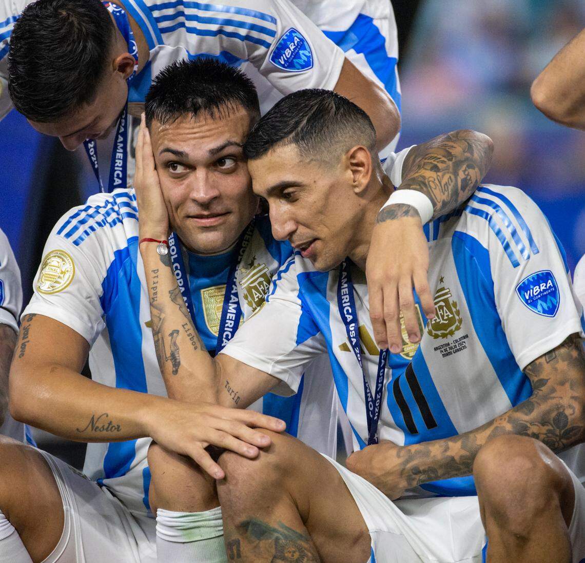 Argentina players Ángel Di Maria (11) Lautaro Martínez (22) celebrates after defeating Colombia in their Copa America 2024 Final soccer match at Hard Rock Stadium on Sunday, July 14, 2024, in Miami Gardens, Fla.