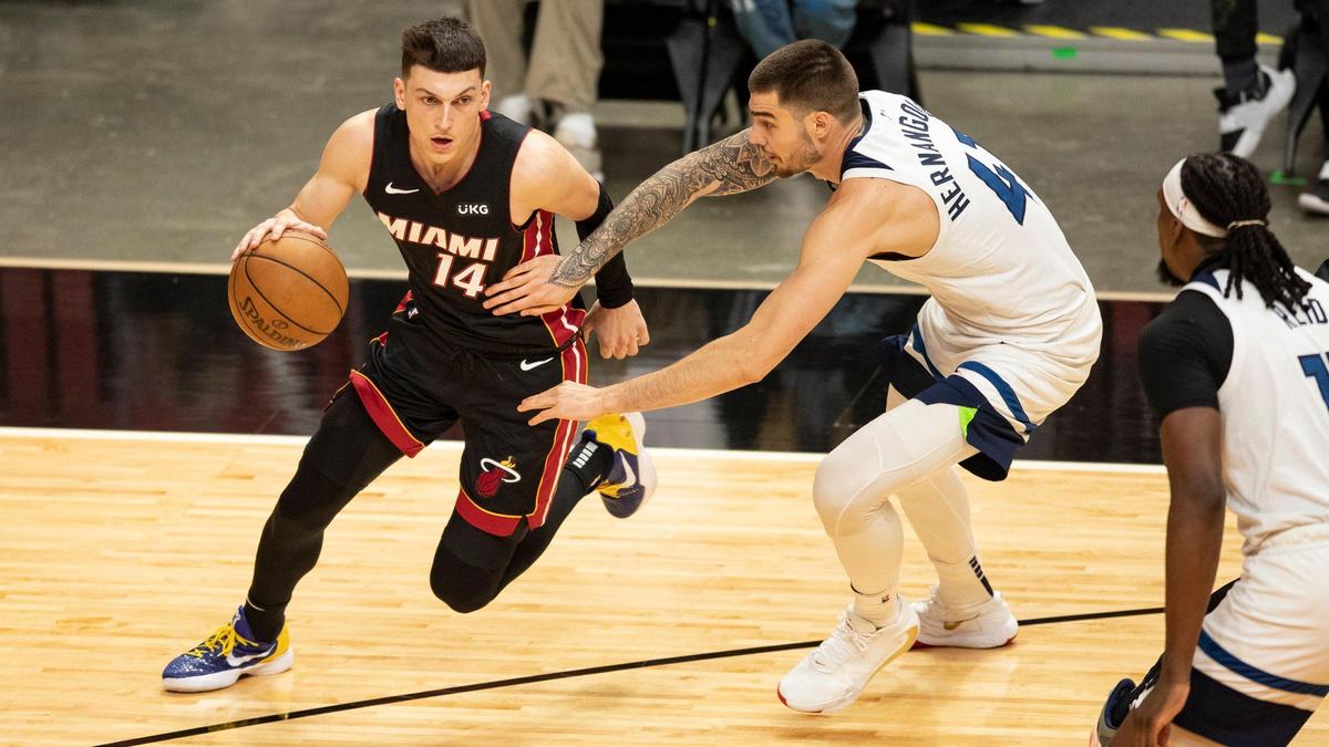 Miami Heat guard Tyler Herro (14) drives to the basket as Minnesota Timberwolves forward Juancho Hernangomez (41) defends in the third quarter at AmericanAirlines Arena in Miami on Friday, May 7, 2021.