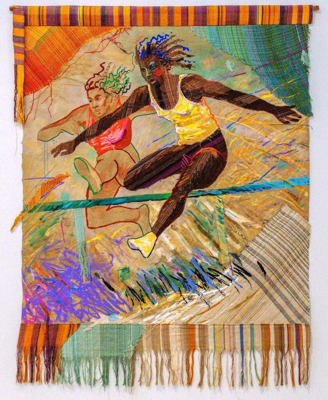 Emma Amos’s “Hurdlers I” (1983) blends painting and textile, depicting women athletes in mid-leap while incorporating handwoven elements that reference African kente cloth.