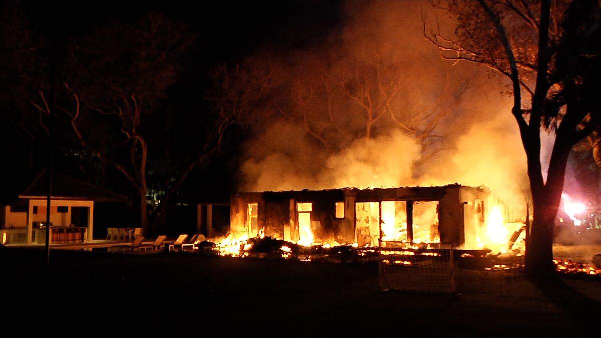 Flames shoot from a home at a single-family residence at 4875 SW 80th St. in Miami-Dade.