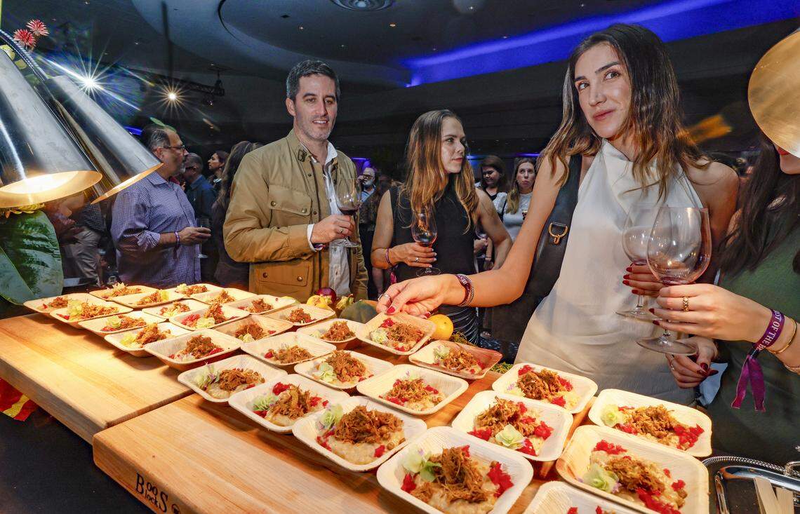La Côte Mediterranean Restaurant serves up Sultan’s Delight to guests Santiago Nieto, Andreina Chacin and Christine Stech, left to right, as the Fontainebleau Miami Beach presents Wine Spectator's Best of the Best with 60 of the nation’s most acclaimed chefs and more than 65 of the world’s premier wineries at the resort hotel on Friday, February 20, 2026.