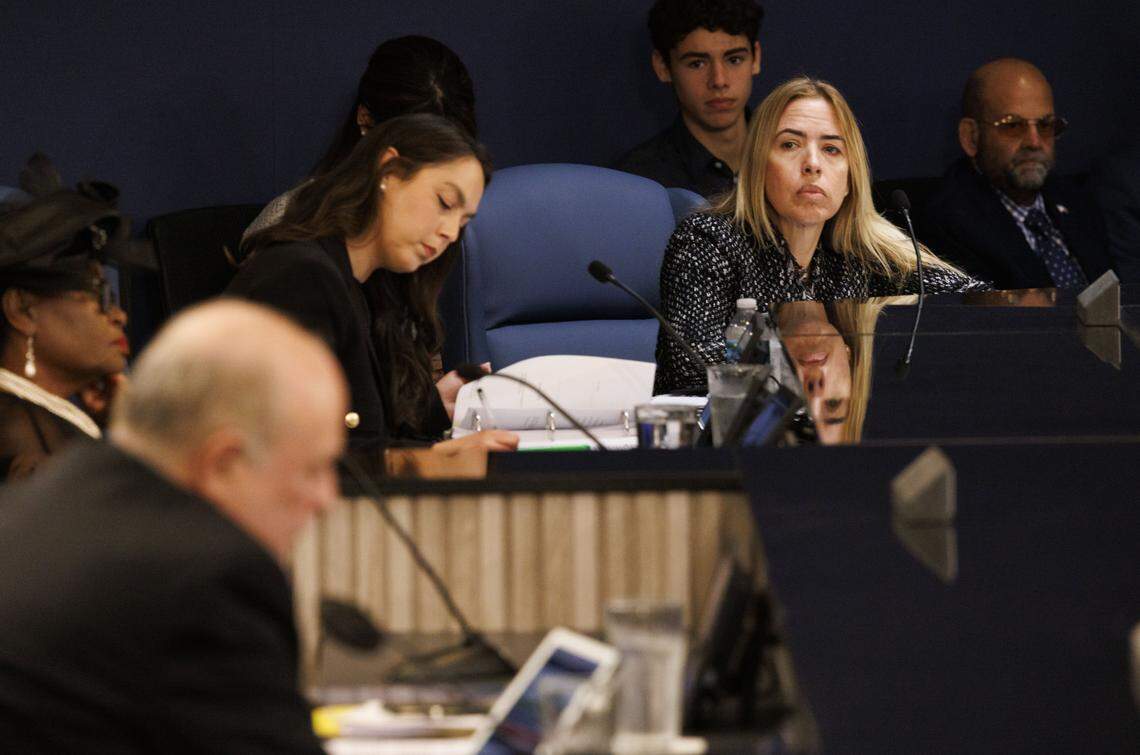 Raquel Regalado listens to Juan Carlos Bermudez speak during a Miami-Dade County Commission meeting where they voted on the appointment of State Rep. Vicki Lopez to the open District 5 seat commission on Tuesday, Nov. 18, 2025, at the Stephen P Clark Center in downtown Miami, Fla.