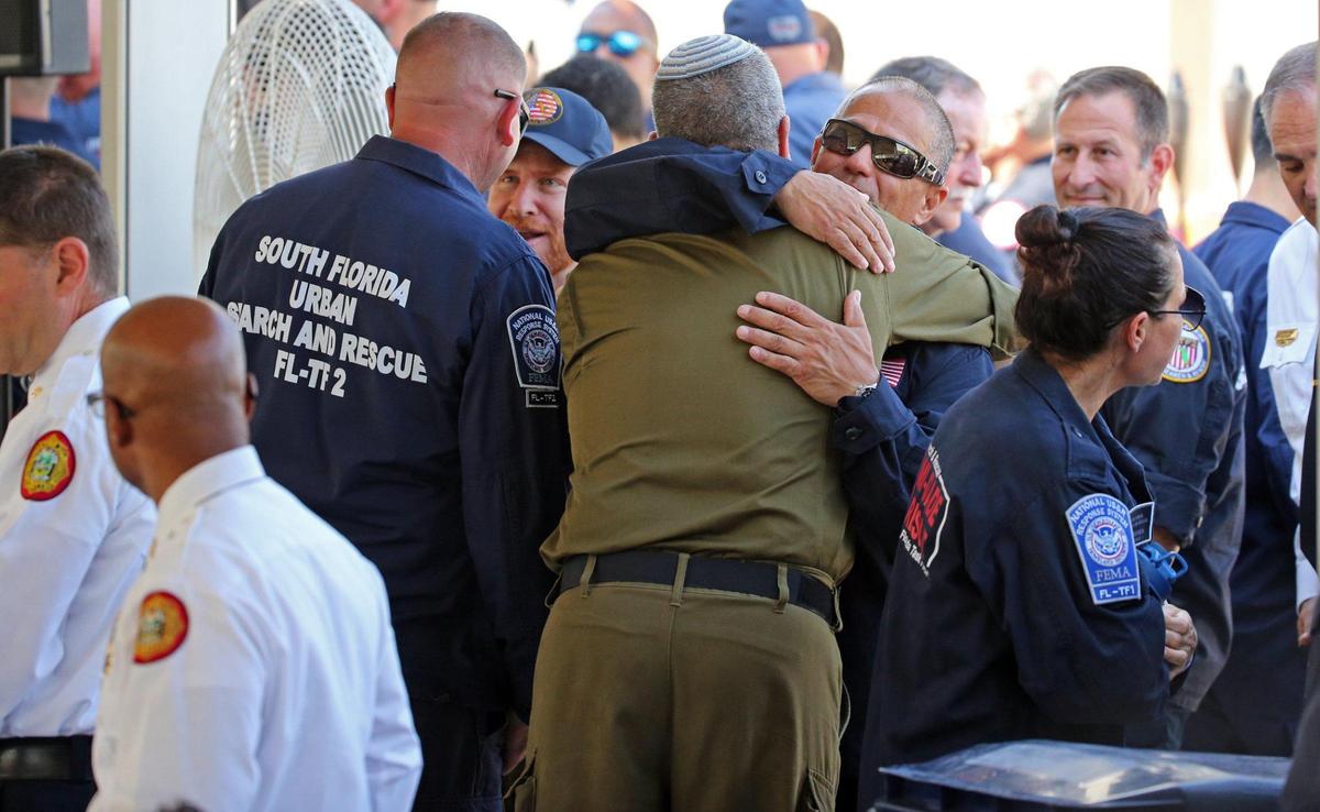First responders arrive for a public memorial event to mark the one-year anniversary on Friday, June 24, 2022 of the collapse of Champlain Towers South in Surfside, Florida.