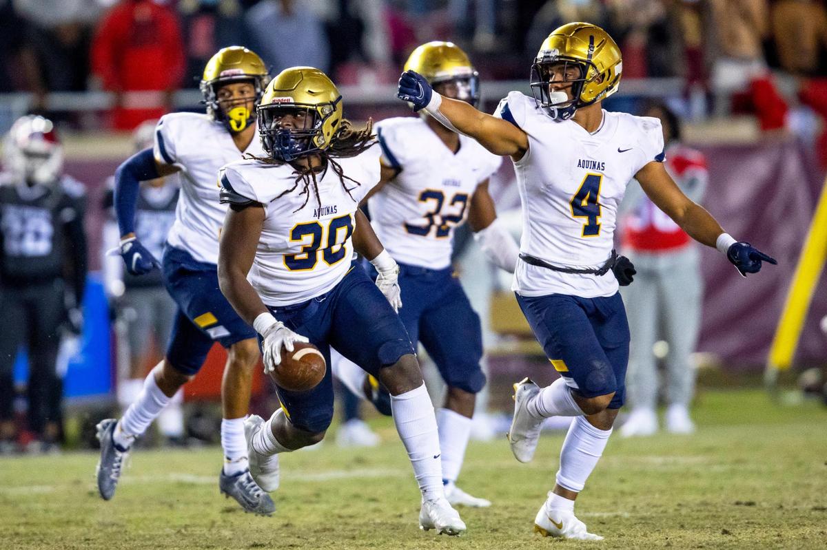 St. Thomas Aquinas High School linebacker Derrieon Craig (30) reacts with his teammates after recovering the fumble from Edgewater High School during the first half of the Class 7A State Championship at Doak Campbell Stadium in Tallahassee, Florida, on Saturday, December 19, 2020.