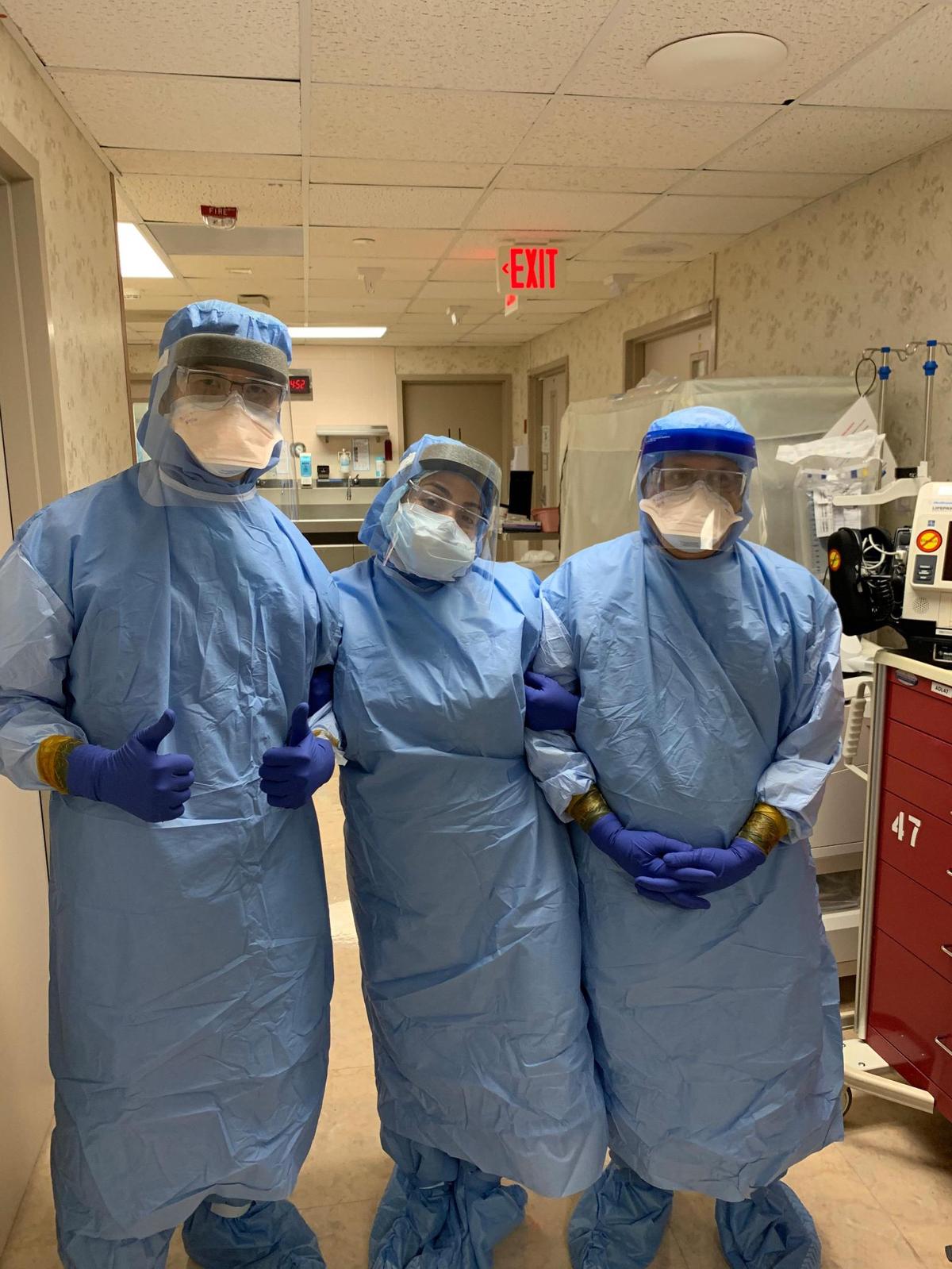  Anabel Arcila, center, the Baptist NICU nurse charged with taking care of&nbsp;Giana Marie Verde. She and her two colleagues are prepped for the day Giana’s mother Monica Verde gave birth. Monica had COVID but Giana was born healthy.