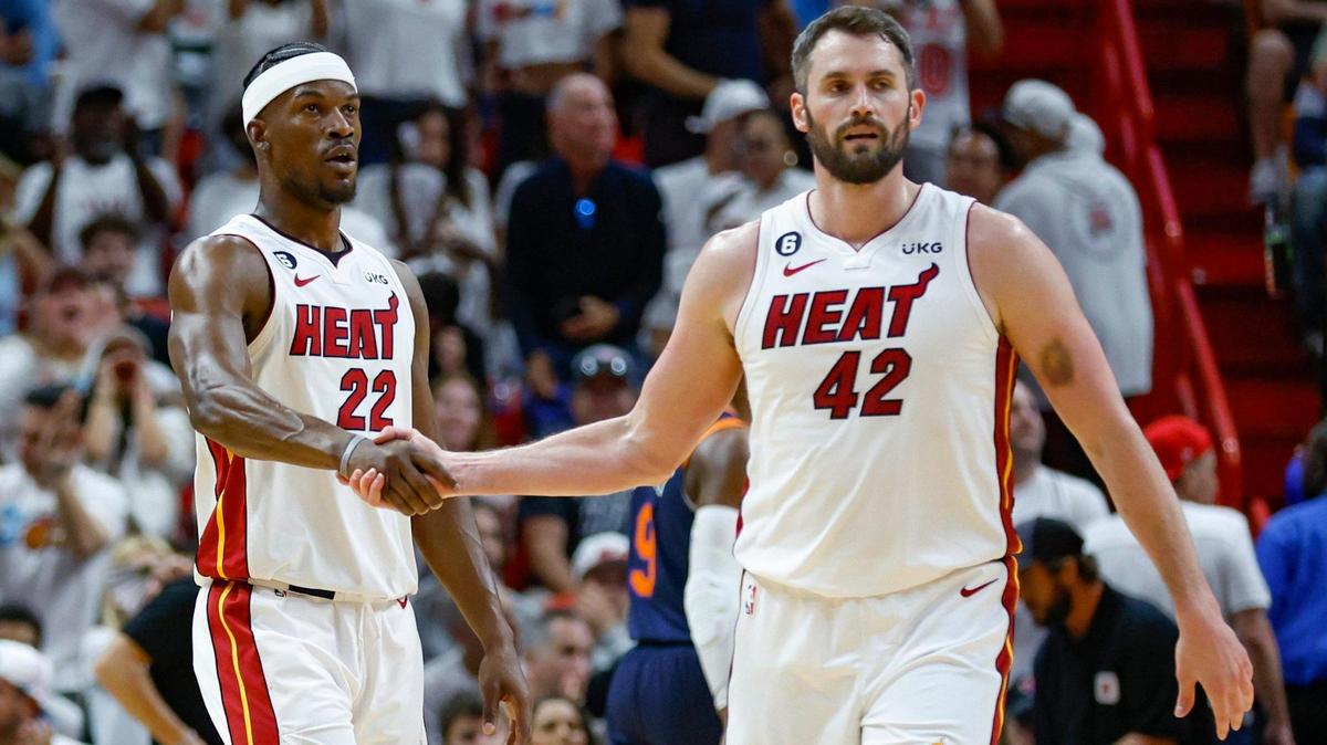 Miami Heat forward Kevin Love (42) andforward Jimmy Butler (22) shakes hands on the court in the game against the New York Knicks in the first quarter during Game 3 of the NBA Eastern Conference Semifinals at the Kaseya Center in Miami on Saturday, May 6, 2023.