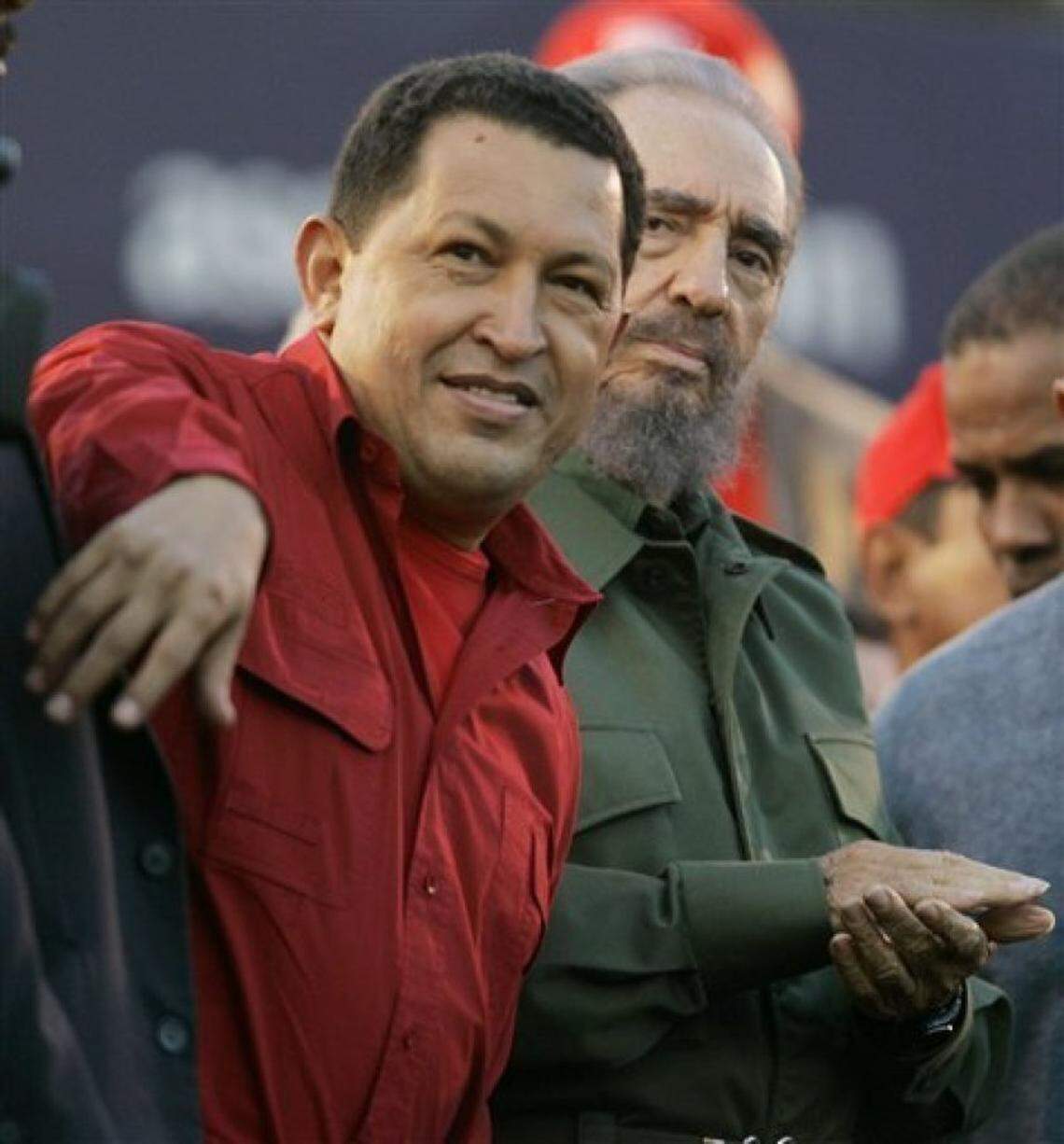 Venezuela’s late President Hugo Chávez, left, sits with Cuba’s President Fidel Castro during a 2006 event in Cordoba, Argentina.