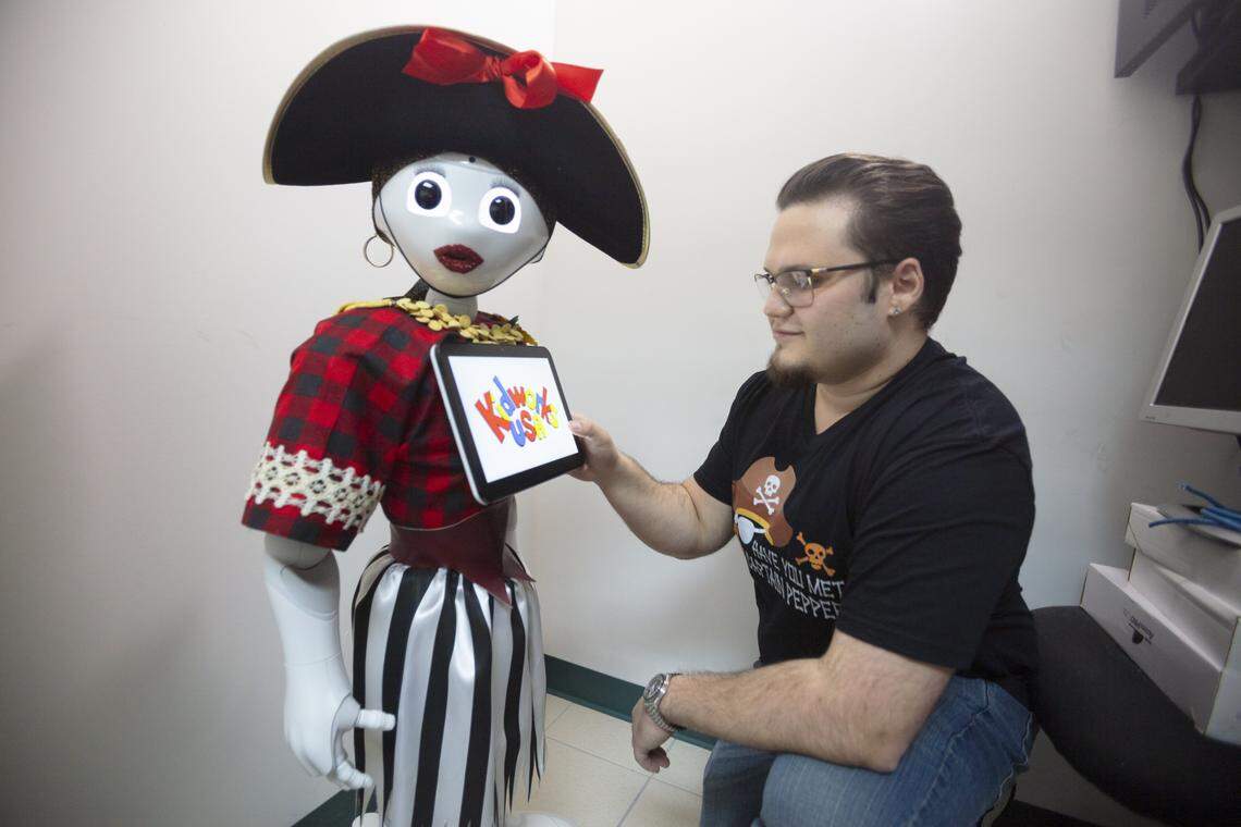 Kevin Soto adjusts Captain Pepper, an interactive educational AI, during an introduction at KidWorks USA in Hialeah, Fla., Monday, Feb. 2, 2026.