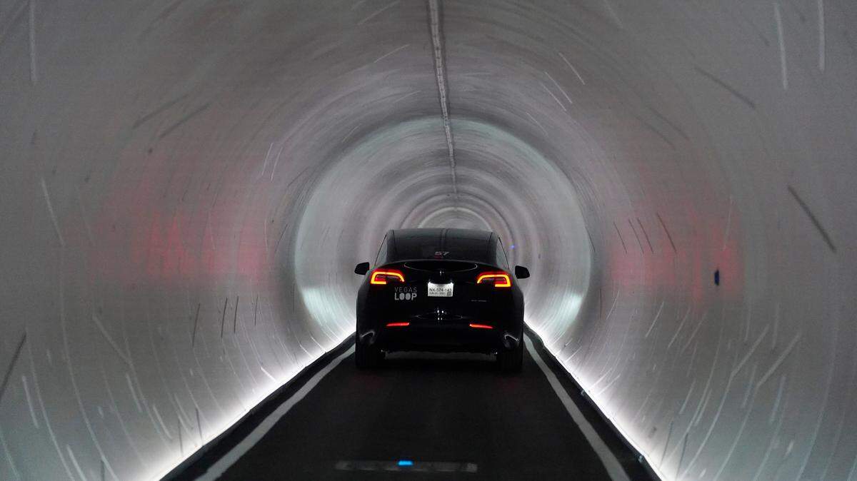 A Tesla car drives through a tunnel in the Las Vegas Convention Center Loop, an underground tunnel developed by Elon Musk’s The Boring Company, Tuesday, June 8, 2021, in Las Vegas. The systems twin tunnels beneath the Convention Center began providing rides for conventioneers in a fleet of Teslas on Tuesday. (AP Photo/John Locher)
