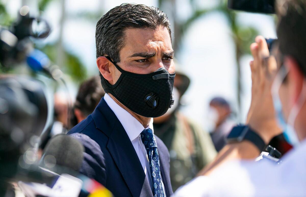 City of Miami Mayor Francis Suarez speaks to members of press after holding a COVID-19 press conference outside of Miami City Hall in Coconut Grove, Florida on Monday, June 22, 2020. A total of 15 Miami-Dade mayors gathered to announce stricter enforcement of COVID-19 rules across the county.