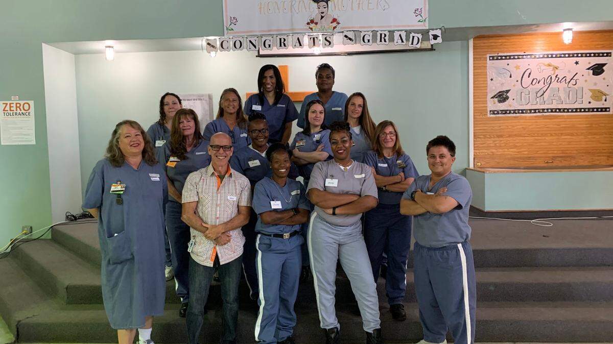 Miami Dade College professor Carlos González guides incarcerated women in meditation and writing. These are the spring 2022 graduates. This semester he has 52 students.