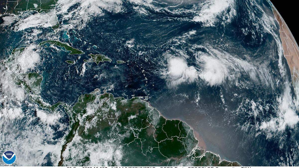 Friday morning satellite imagery reveals that tropical Storms Philippe and Rina are less than 500 miles from each other.