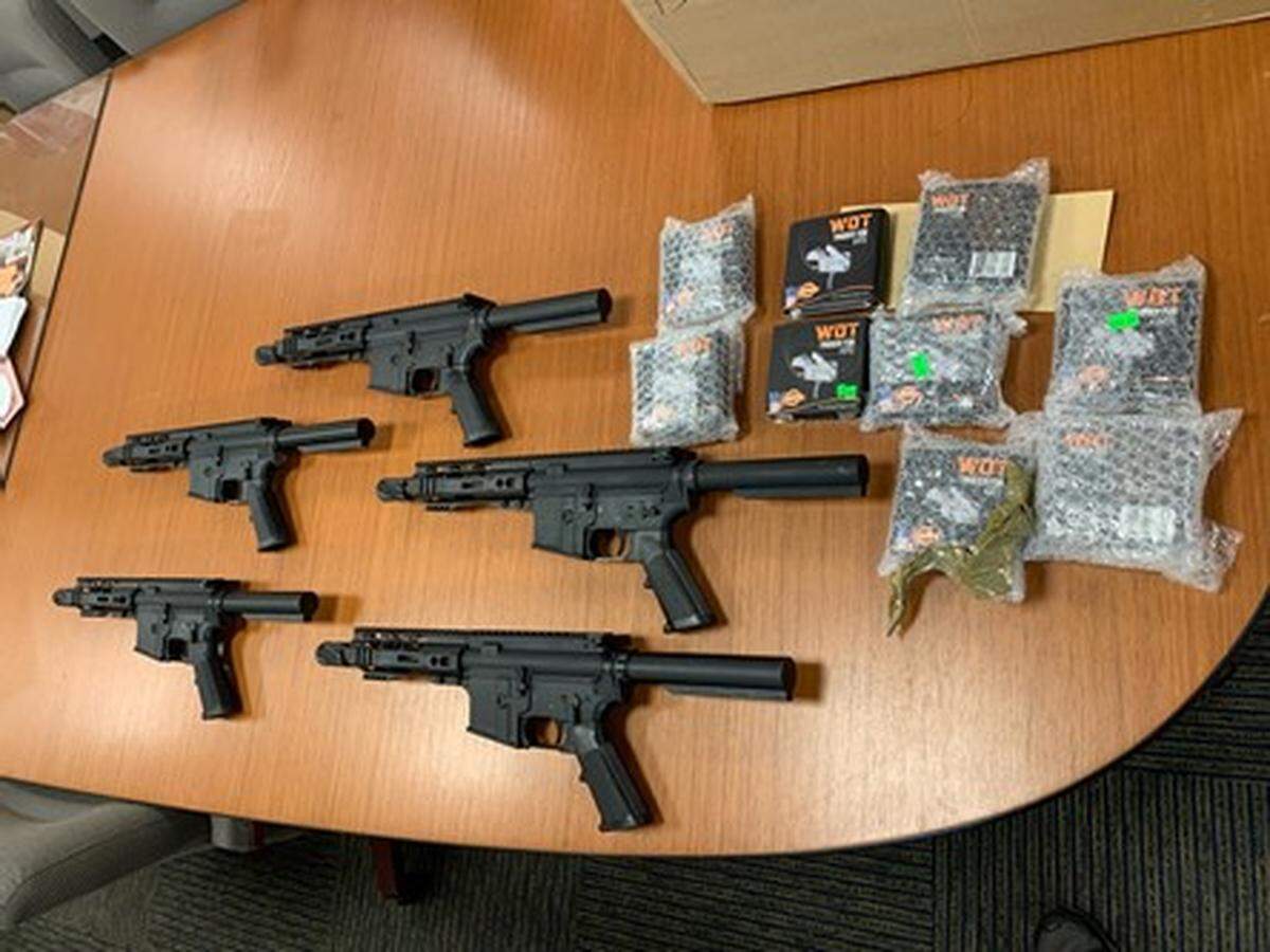 Federal agents seized these firearms and other devices known as “switches” from Miami Gun Shops as part of a weapons case against the federally licensed dealer and an employee.