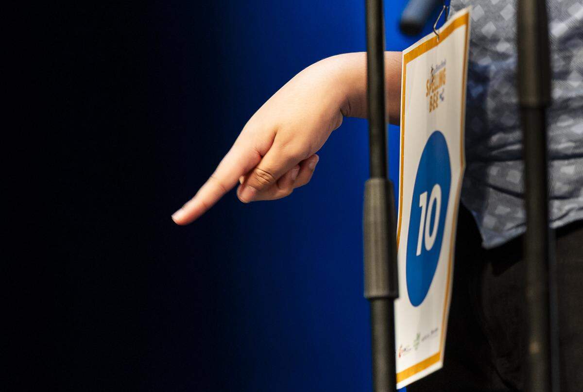 Logan Cox, an eighth grader from Herbert A. Ammons Middle School, uses his finger to write out a word as he competes in the 86th Miami Herald Spelling Bee for Miami-Dade and Monroe County at the Charles F. Dodge City Center on Wednesday, Feb. 25, 2026, in Pembroke Pines, Fla.