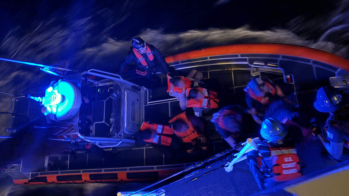 A Coast Guard patrol-boat crew transfers 27 people found on a migrant boat off the western tip of Cuba onto the Cutter Raymond Evans on Thursday night, June 18, 2026.