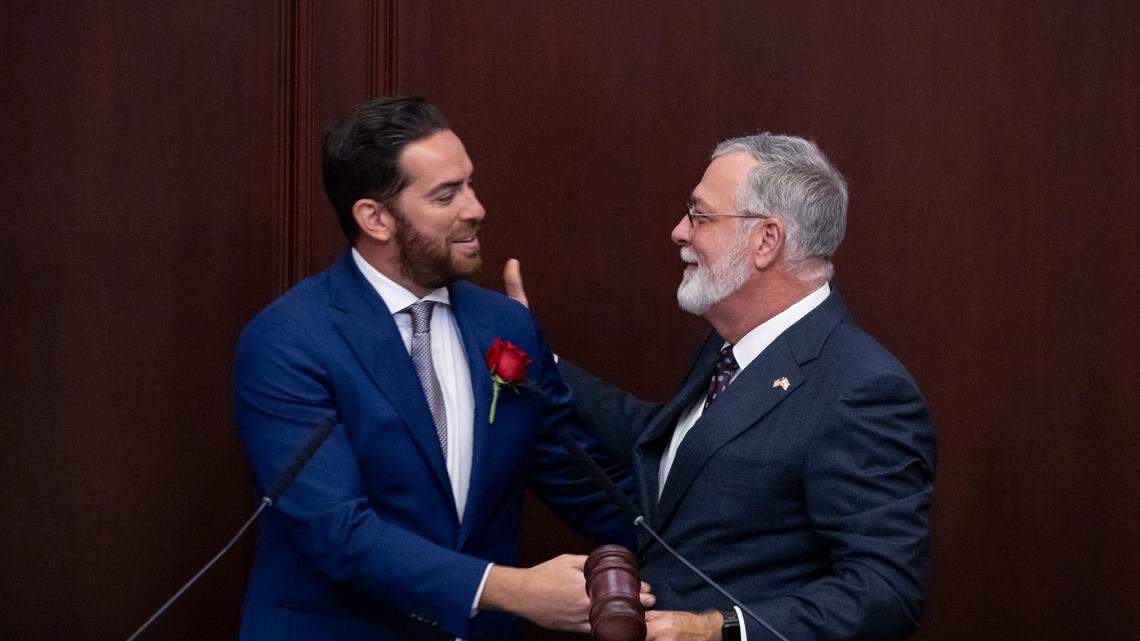 Florida House Speaker Daniel Perez, R-Miami, hands Florida Senate President Ben Albritton, R-Wauchula, the gavel during the first day of the legislative session on March 4 in Tallahassee.