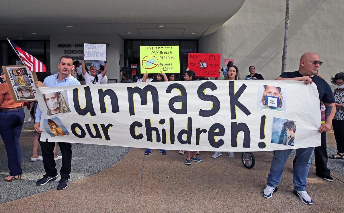 Protesters at an “Un-mask Our Kids” rally at the School Board administration building on May 19, 2021. Twenty-one speakers signed up to speak about masks during public comment. Many are against masks in schools.