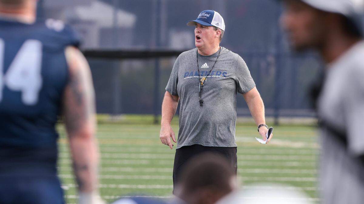 FIU Head Coach Mike MacIntyre calls plays and instructions as he kept a close eye on his team during practice. On Monday, August 1, 2022 FIU football team opened morning practiced to the media on the practice field on the Tamiami Campus.
