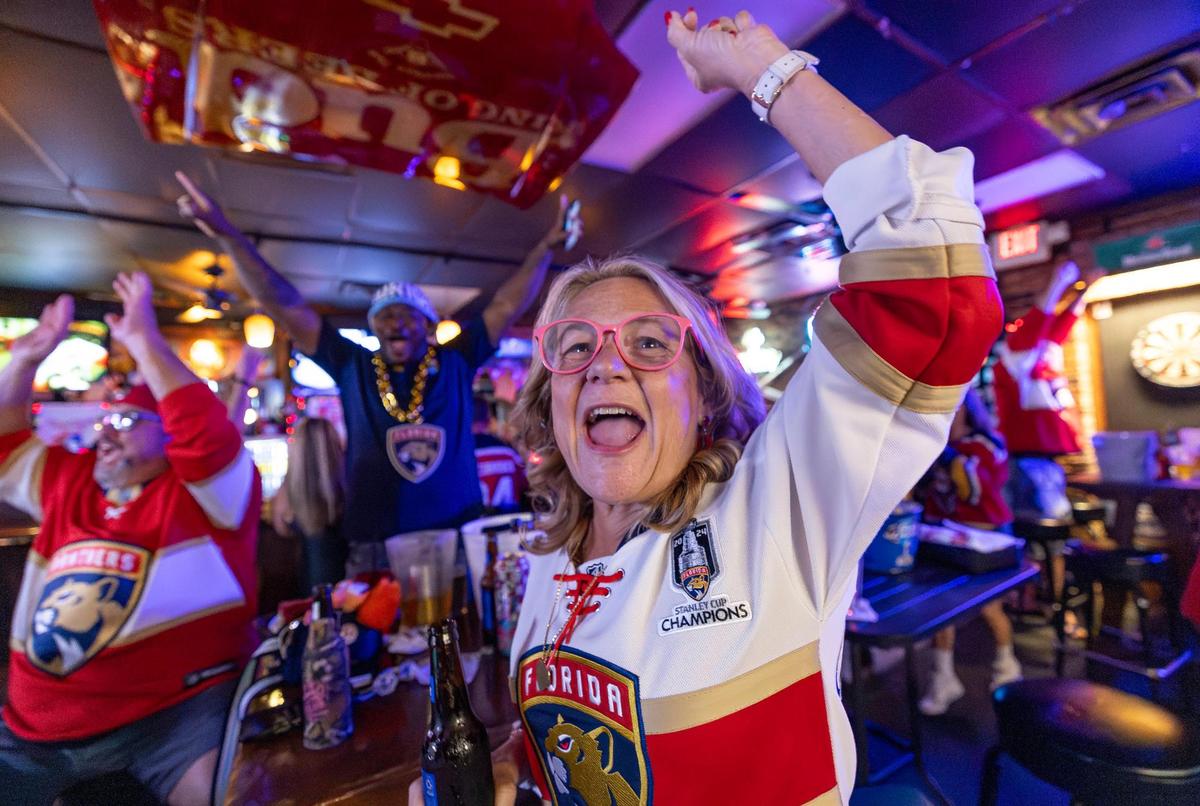 Florida Panthers fan Cheryl Hernandez celebrates after her team scored against the Edmonton Oilers in Game 2 of the NHL Stanley Cup Final at the Inn Field Bar & Grill on Friday, June 6, 2025, in Sunrise, Fla.