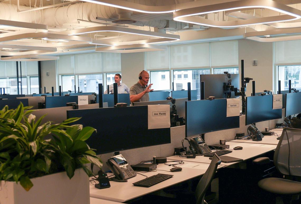 A financial analyst works with a client inside the office of European bank BNP Paribas after announcing the opening of its Brickell office on Wednesday, December 6, 2023 in Miami, Florida.
