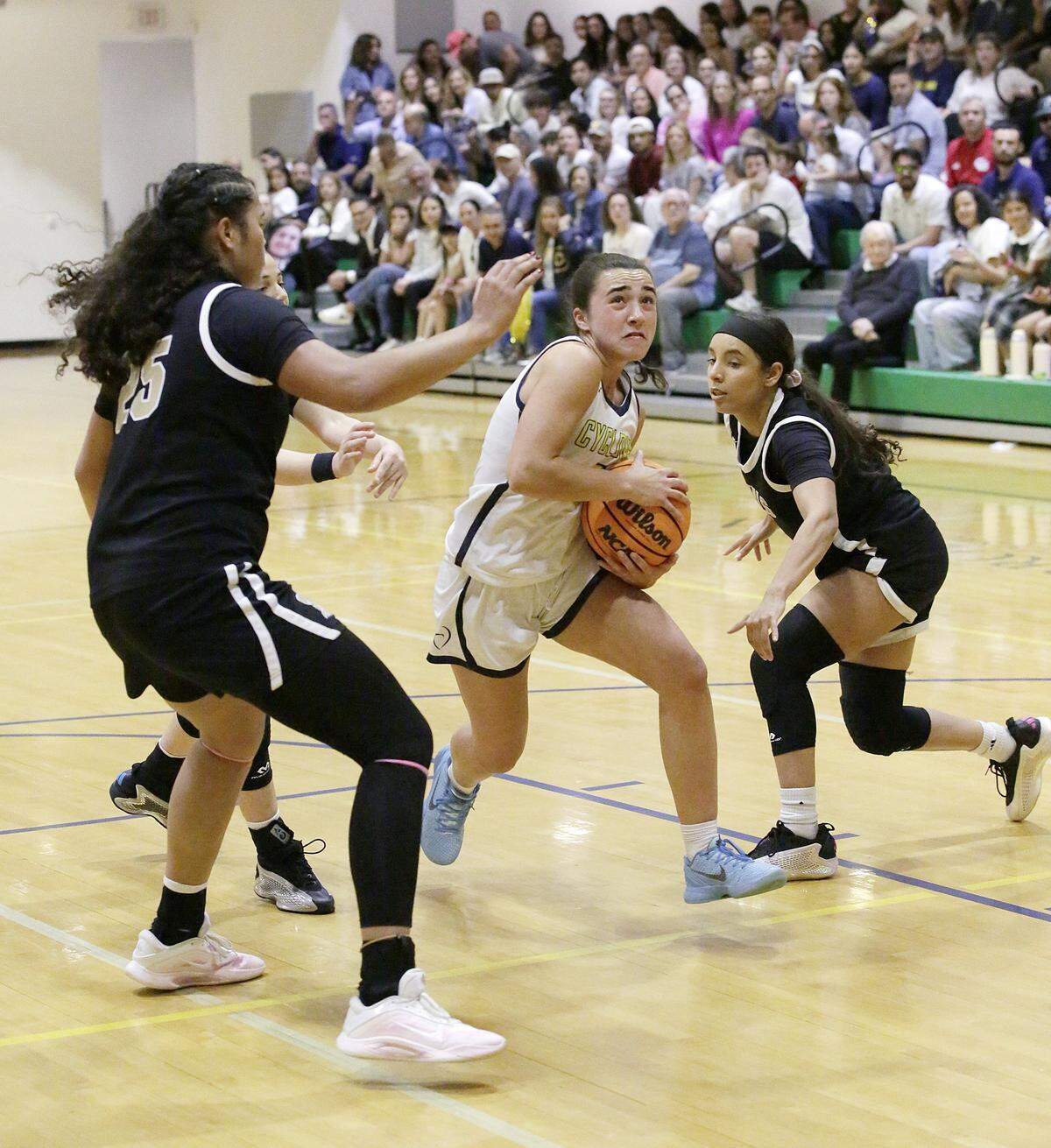 Carrollton Sela Travieso (2) tries to score against La Salle during Region 4-3A girls' basketball final game on Friday, February 27, 2026 at Carrollton School in Coconut Grove. Andrew Uloza / for Miami Herald