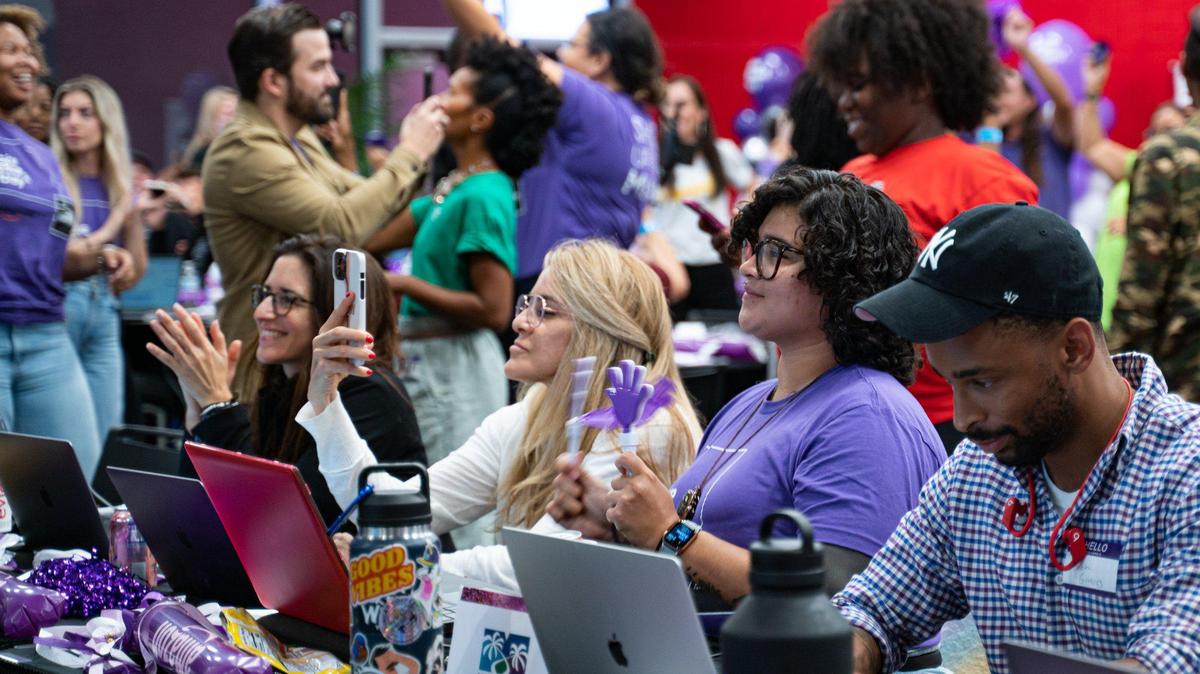 People watch as donations come in during Give Miami Day at Miami Dade College Wolfson campus in November 2022. Give Miami Day 2022 made more than $32 million.