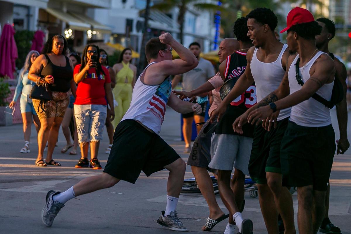 A fight breaks out on Ocean Drive during Spring Break in Miami Beach, Florida, on Friday, March 26, 2021.