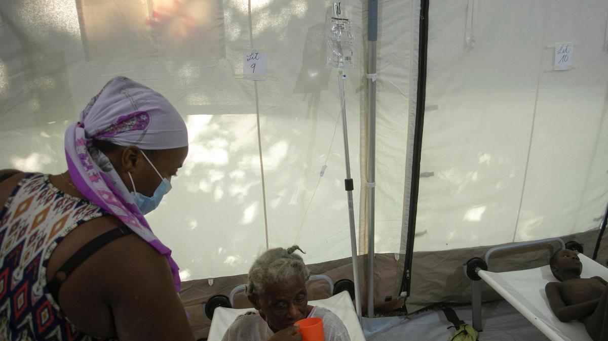 A patient suffering cholera symptoms drinks a serum at a clinic run by Doctors Without Borders in Port-au-Prince, Haiti, Friday, Oct. 7, 2022.