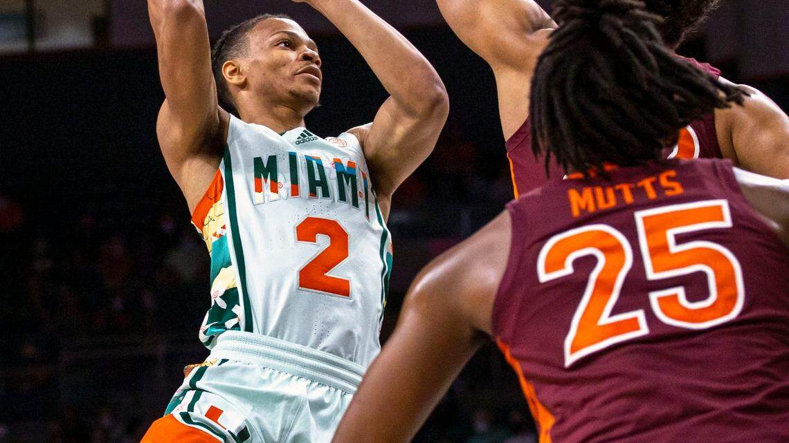 University of Miami guard Isaiah Wong (2) shoots over Virginia Tech forward Keve Aluma (22) during the first half of an NCAA basketball game at the Watsco Center in Coral Gables, Florida, on Saturday, February 26, 2022.