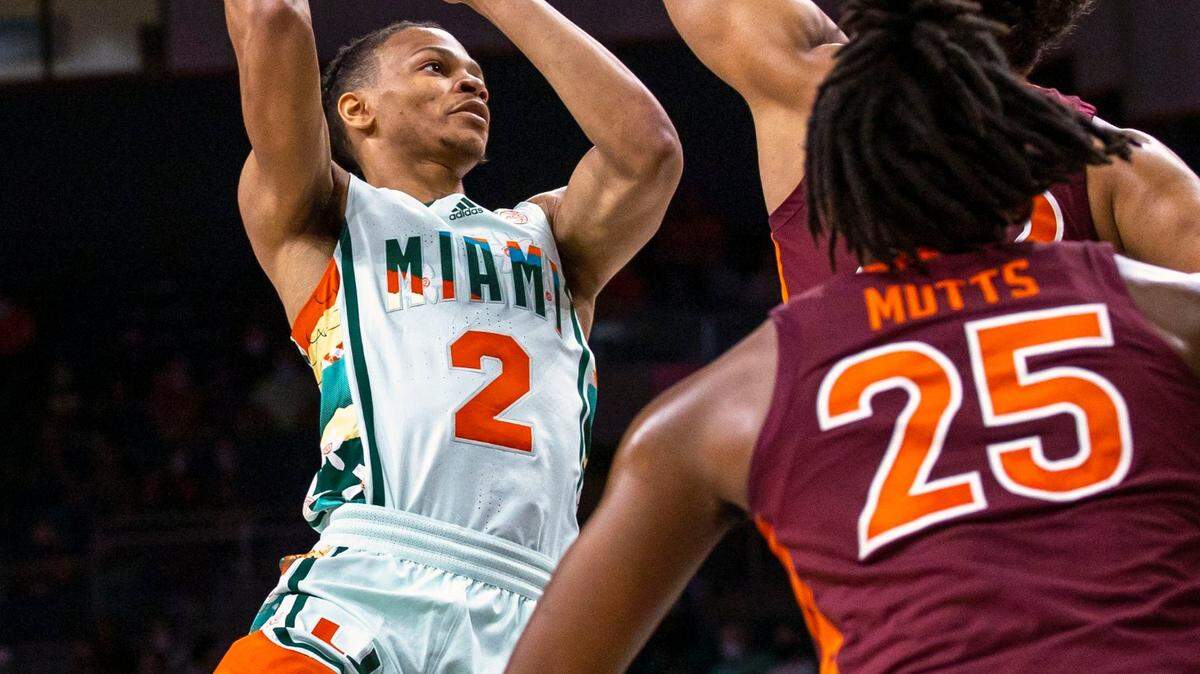 University of Miami guard Isaiah Wong (2) shoots over Virginia Tech forward Keve Aluma (22) during the first half of an NCAA basketball game at the Watsco Center in Coral Gables, Florida, on Saturday, February 26, 2022.