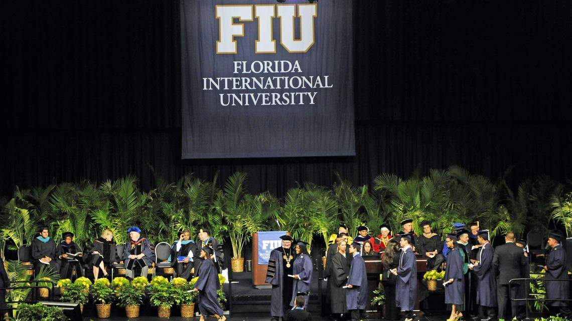 Florida International University graduates march across the stage to get diplomas at a ceremony held at the Modesto Maidique Campus in 2012.