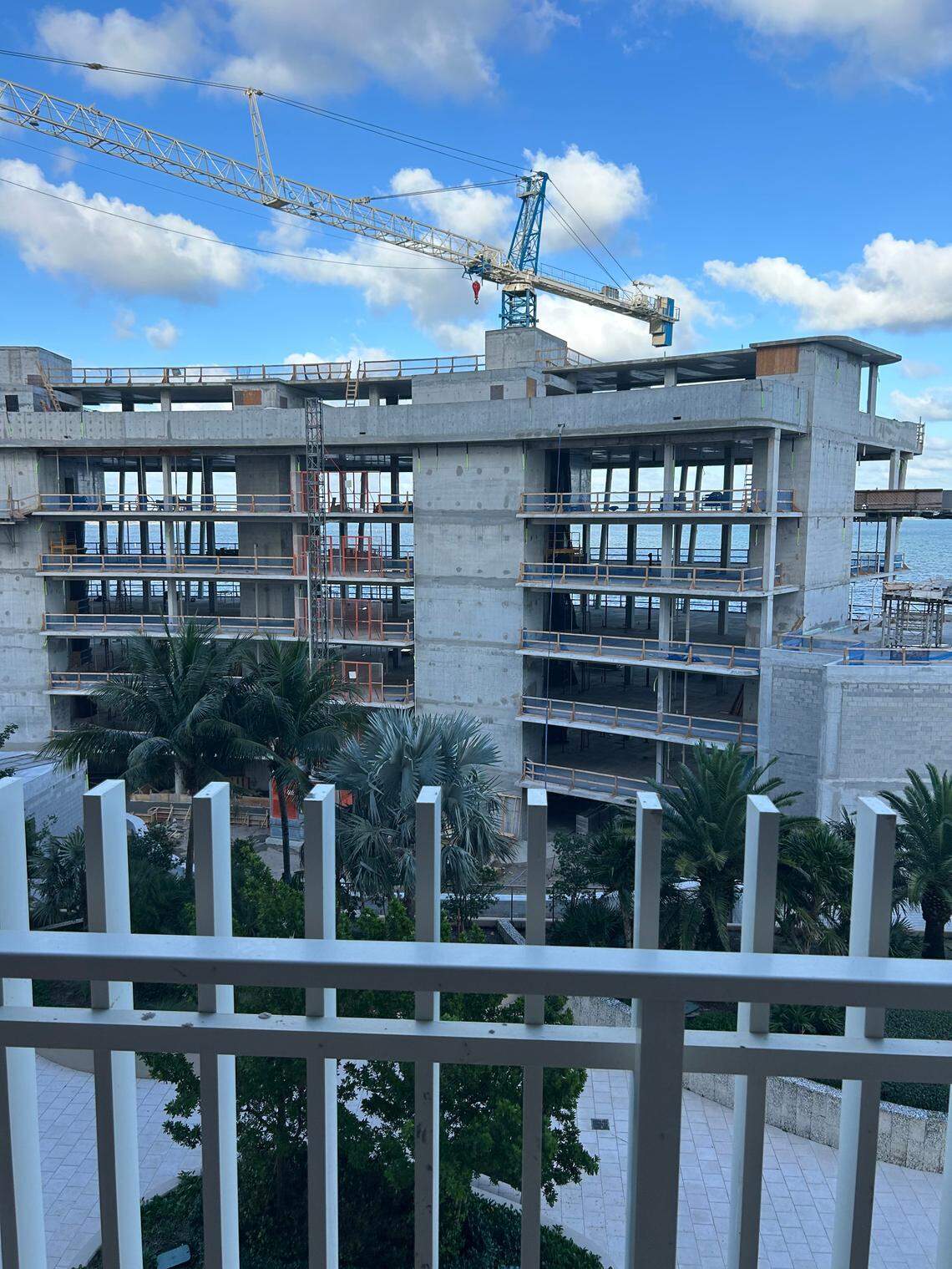 Grove Isle homeowner Wendy Gordon’s view from her Building 3 balcony as the new seven-story condo building, Vita, is being constructed.