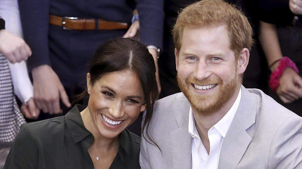 FILE - In this file photo dated Wednesday Oct. 3, 2018, Meghan, Duchess of Sussex and Britain’s Prince Harry, make an official visit to the Joff Youth Centre in Peacehaven, Britain.  Kensington Palace announced Monday Oct. 15, 2018, that Prince Harry and his wife the Duchess of Sussex are expecting a child in spring 2019.  (Chris Jackson/pool via AP)
