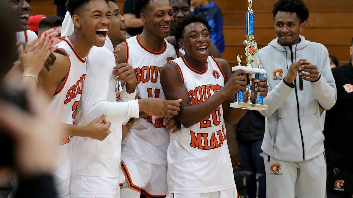 South Miami players celebrate as they win the GMAC basketball final against the Norland team at South Miami High School .on Thursday, February 06, 2020.