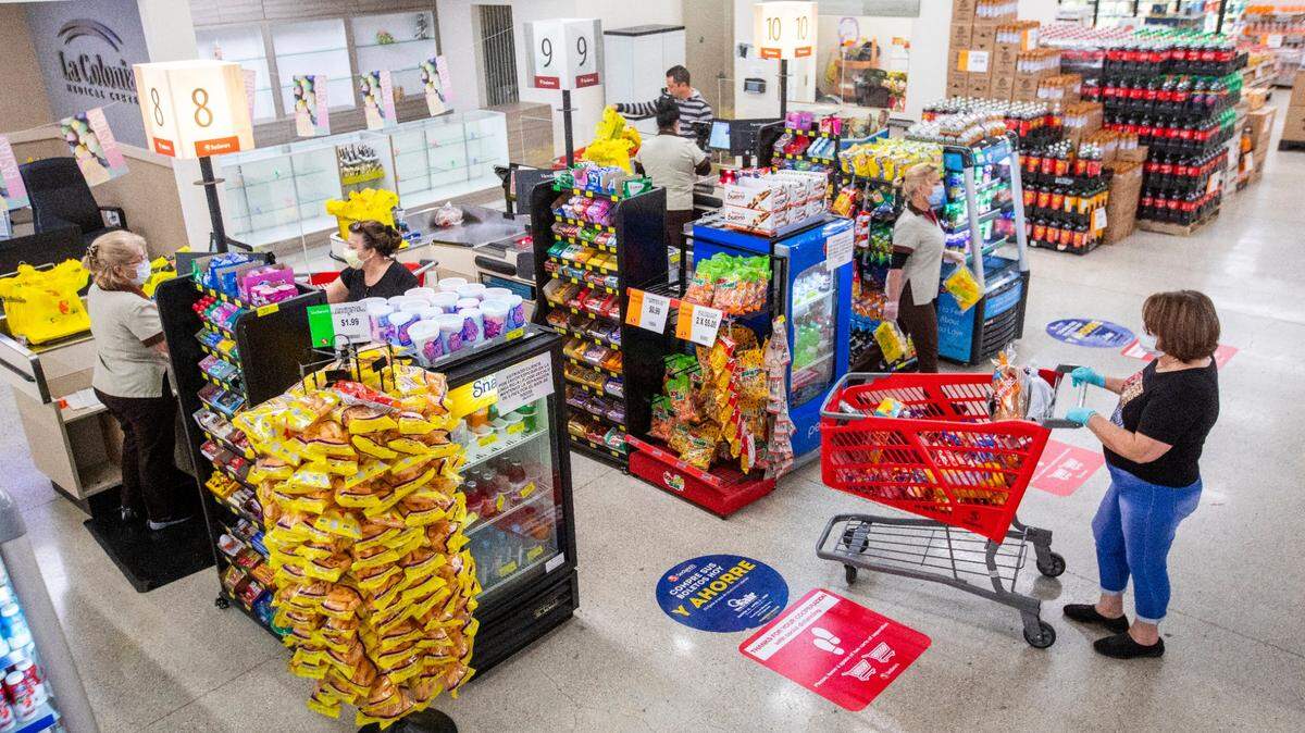 Shoppers maintain 6 feet of distance between one another as they line up to pay for their groceries at a Sedano’s Supermarket in Hialeah on April 1. CEOs were asked: There is currently a debate about whether the economy is experiencing inflation, and where it may be showing up. What goods or services have you seen appreciating rapidly in value?