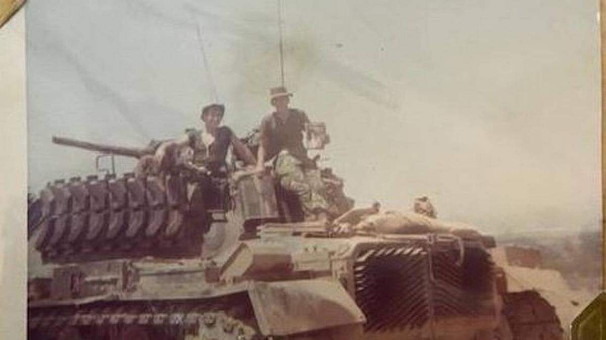 Marine Pfc. Bruce Carter, right, with his squad leader, Mike Neel, of California, in a tank near enemy terrain, in 1969, along the coastal plain of Con Tien, Vietnam. He died in 1969 when he threw himself over a grenade to protect his fellow Marines. He was 19 and from Virginia Gardens.