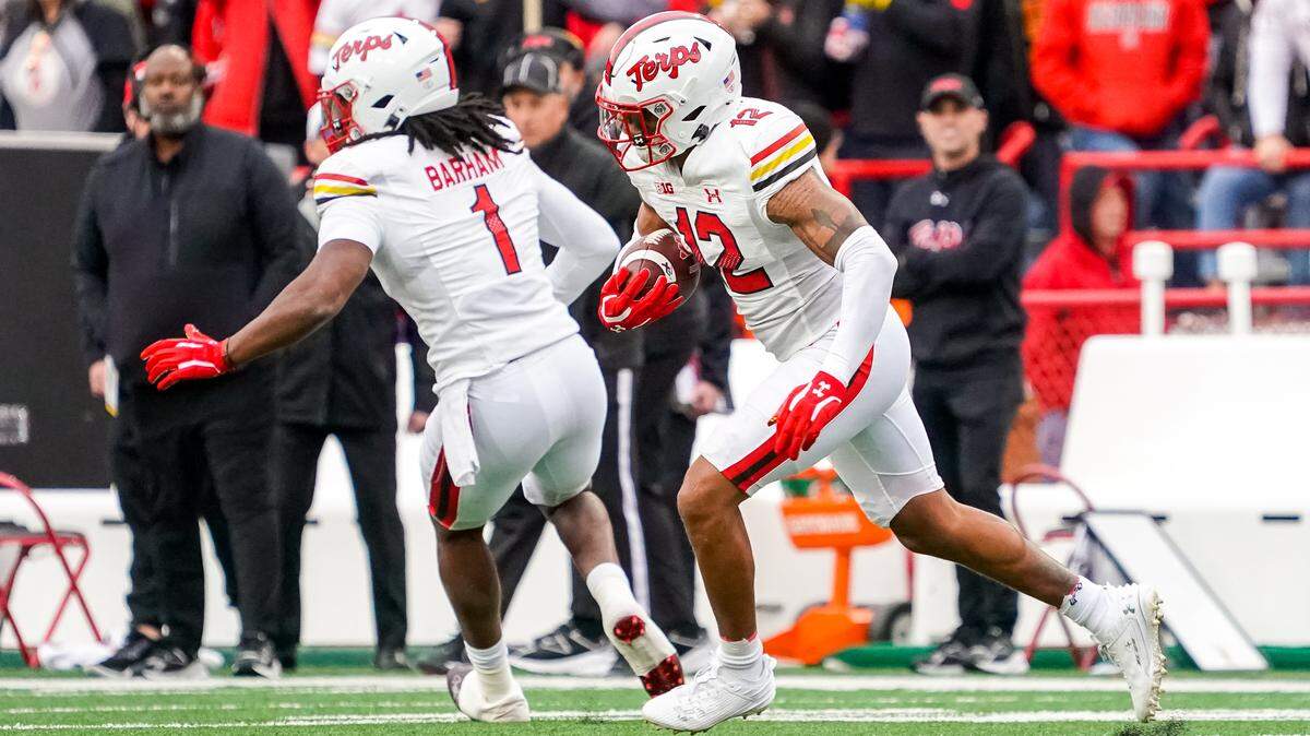 Nov 11, 2023; Lincoln, Nebraska, USA; Maryland Terrapins defensive back Dante Trader Jr. (12) runs after getting an interception against the Nebraska Cornhuskers during the first quarter at Memorial Stadium.