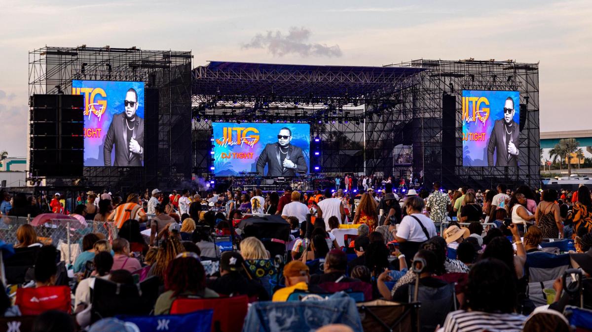 Festival goers watch the performances during Jazz in the Gardens at Hard Rock Stadium Arena in Miami Gardens, Florida, on Saturday, March 9, 2024.
