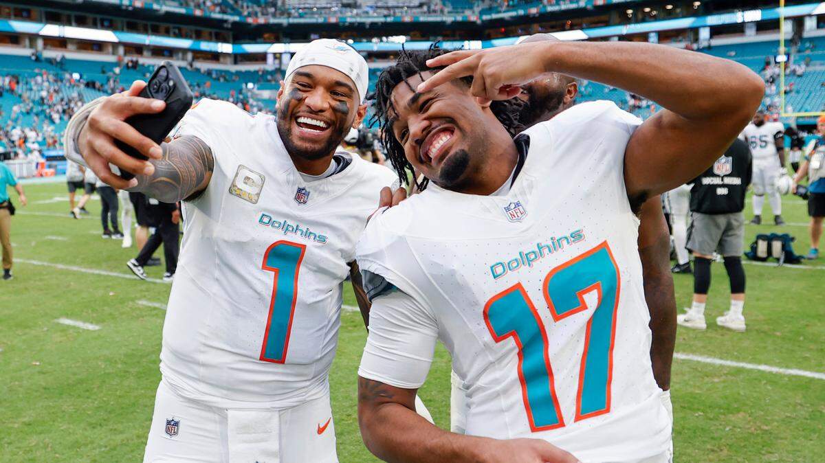 Miami Dolphins quarterback Tua Tagovailoa (1) and wide receiver Jaylen Waddle (17) pose for a selfie after the win against the Las Vegas Raiders of their NFL game in Miami Gardens, Florida on Sunday, November 17, 2024.