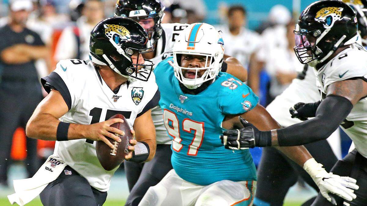 Miami Dolphins defensive tackle Christian Wilkins (97) eyes Jacksonville Jaguars quarterback Gardner Minshew (15) during a preseason game last year.