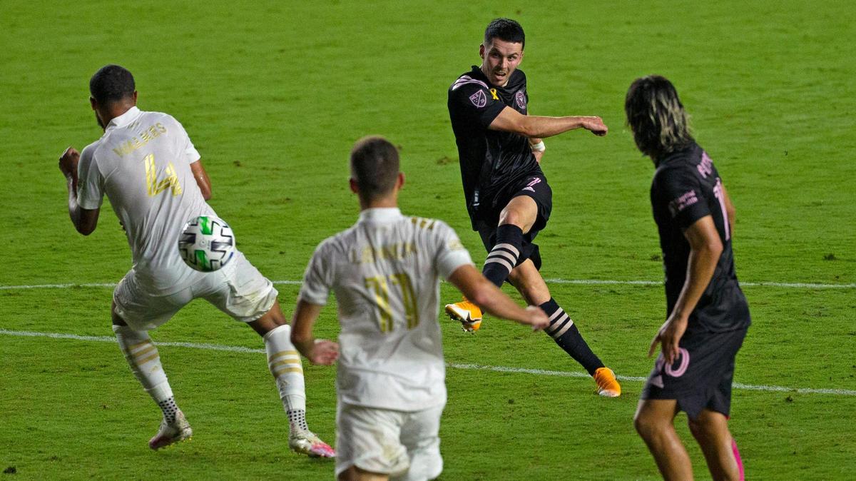 Inter Miami CF midfielder Lewis Morgan (7) kicks the ball to scores against the defense of Atlanta United FC defender Anton Walkes (4) during the first half of an MLS soccer match at Inter Miami CF Stadium on Wednesday, September 9, 2020, in Fort Lauderdale, Florida.