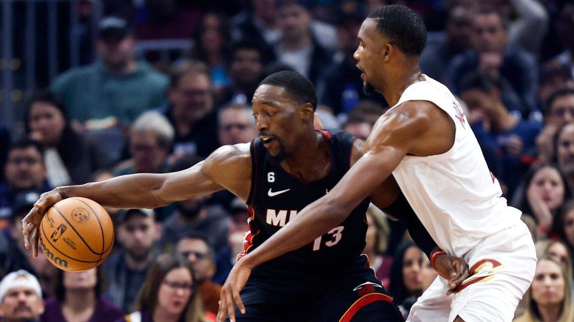 Miami Heat center Bam Adebayo (13) plays against Cleveland Cavaliers forward Evan Mobley, right, during the first half of an NBA basketball game, Sunday, Nov. 20, 2022, in Cleveland.