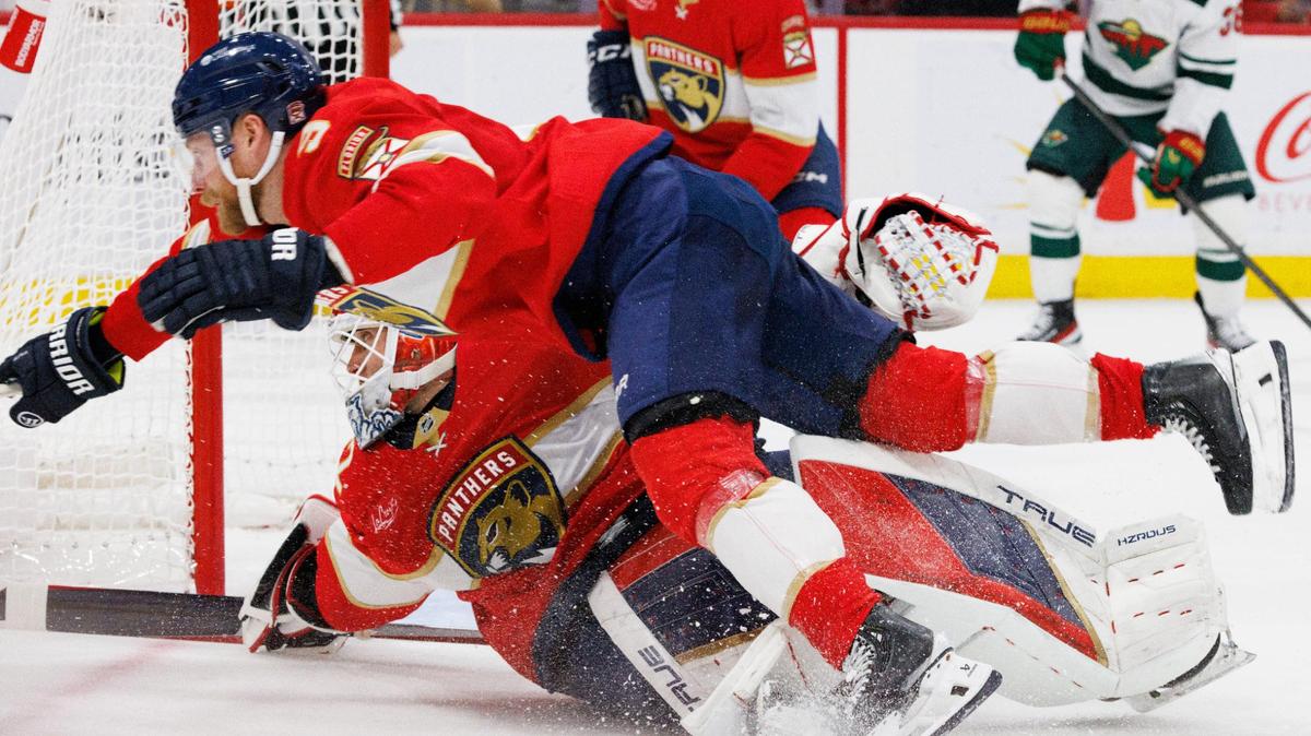 Florida Panthers center Sam Bennett (9) dives over goaltender Sergei Bobrovsky (72) and Bobrovsky is out of the net and the Minnesota Wilds score during the second period of a game on Tuesday, Oct. 22, 2024, at Amerant Bank Arena in Sunrise, Fla.