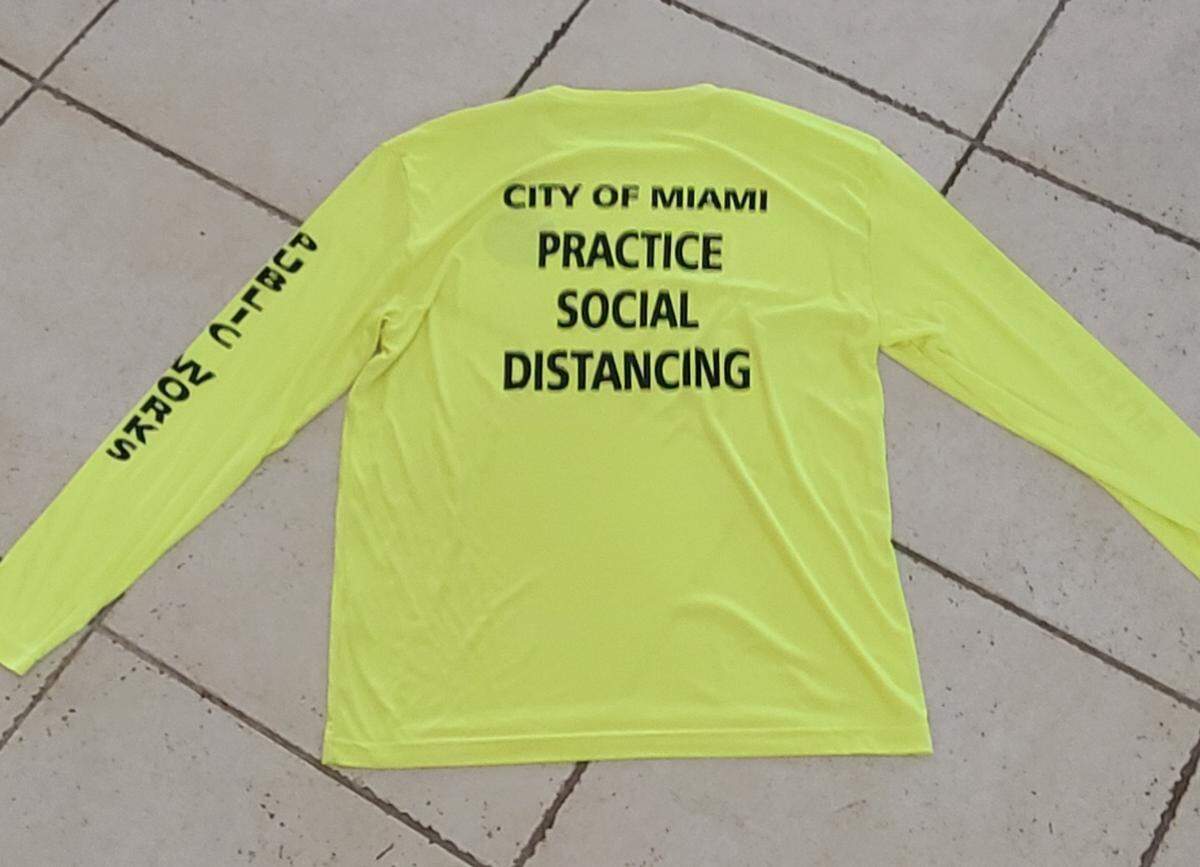Miami city administrators distributed these shirts to workers in the department of resilience and public works earlier in the summer, even as workers complained department leaders were not enforcing social distancing at work and requiring crews of four or five people to ride to job sites in one vehicle.