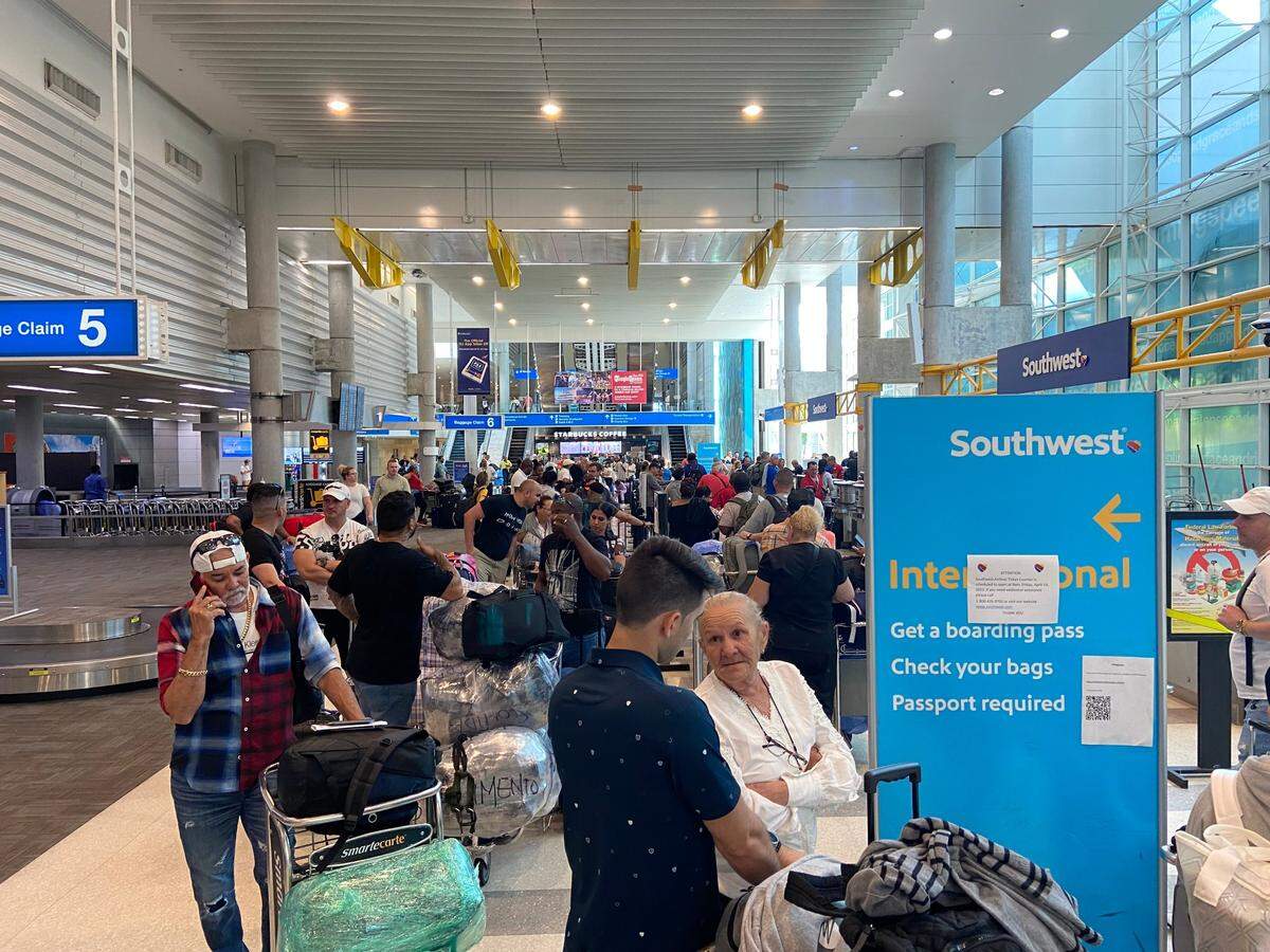 Passengers begin the check-in process in long lines at the Southwest Airlines check-in counter at Fort Lauderdale International Airport Friday Morning, April 14, 2023. 