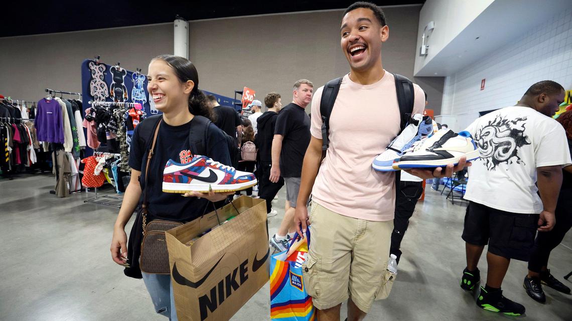 Couple Bianca Reyes, 23, and Ozzie Gonzalez, 24, of Fort Myers, carry valuable pairs of rare Nike sneakers at Sneaker Con at the Broward County Convention Center in Fort Lauderdale, Florida, on Saturday, Jan. 11, 2025.