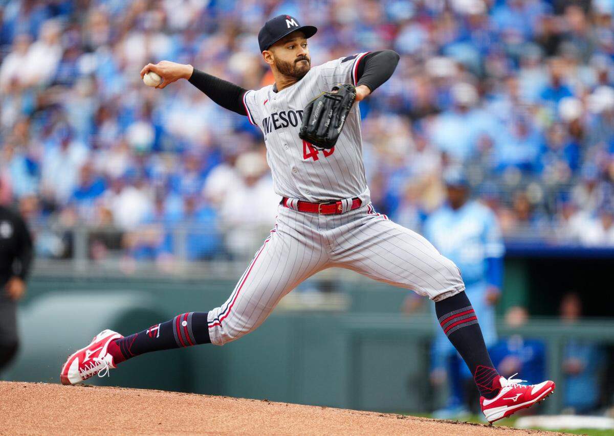 Minnesota Twins starting pitcher Pablo Lopez (49) pitches during the first inning against the Kansas City Royals at Kauffman Stadium on March, 30, 2023.